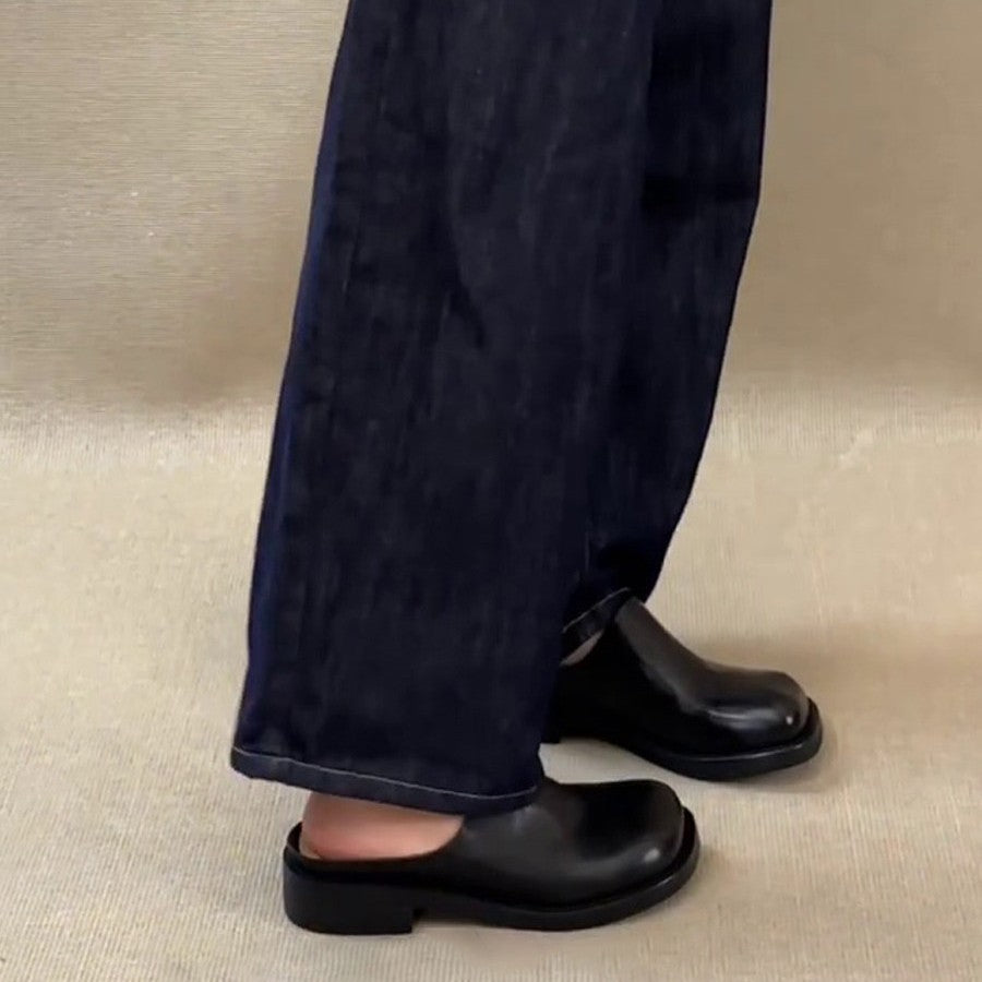 Model wearing Marlowe Square-Toe Mules with dark jeans, close crop