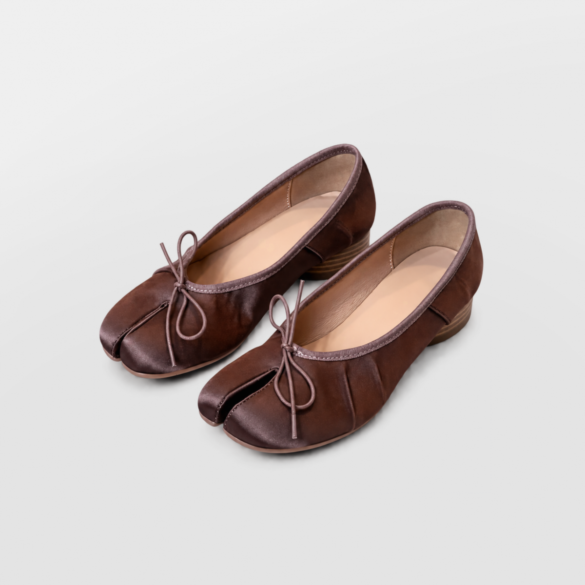 Pair of brown Rosie tabi ballerina pumps angled together on a white background