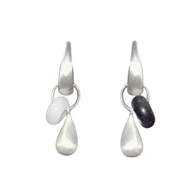 Teardrop earrings from Lil Cacti: the Dew Teardrop Charm Hoop Earrings shown from the side