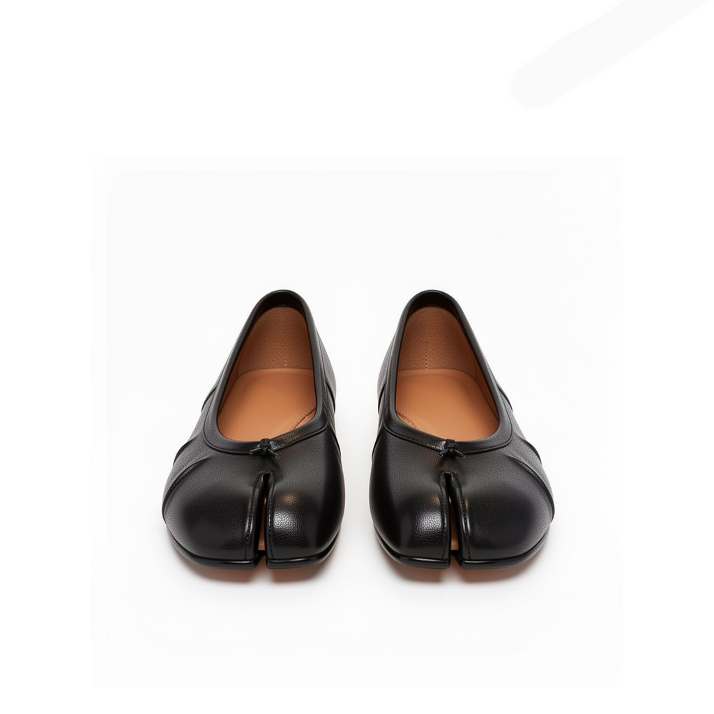 Close-up of tabi split-toe detail on Amelora black leather ballet flats
