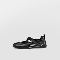 Angled view of black leather cross strap tabi flats on a pale grey ground