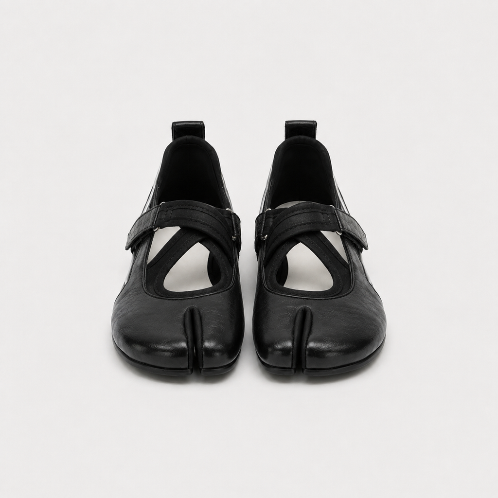 Detail of the smooth black split cowhide upper and stitched sole edge