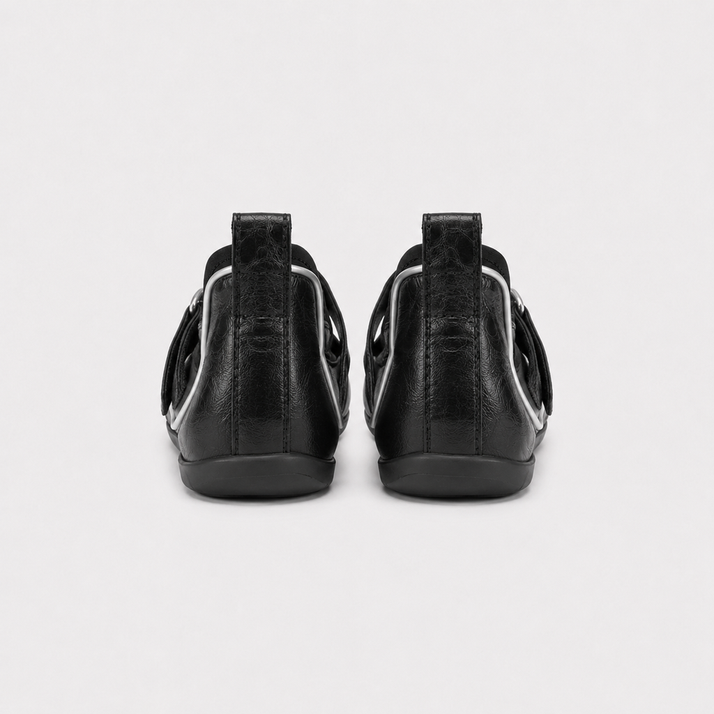 Pair of Lil Cacti black leather tabi ballet flats photographed from above