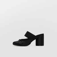 Black satin block heel sandal shown alone against a pale background