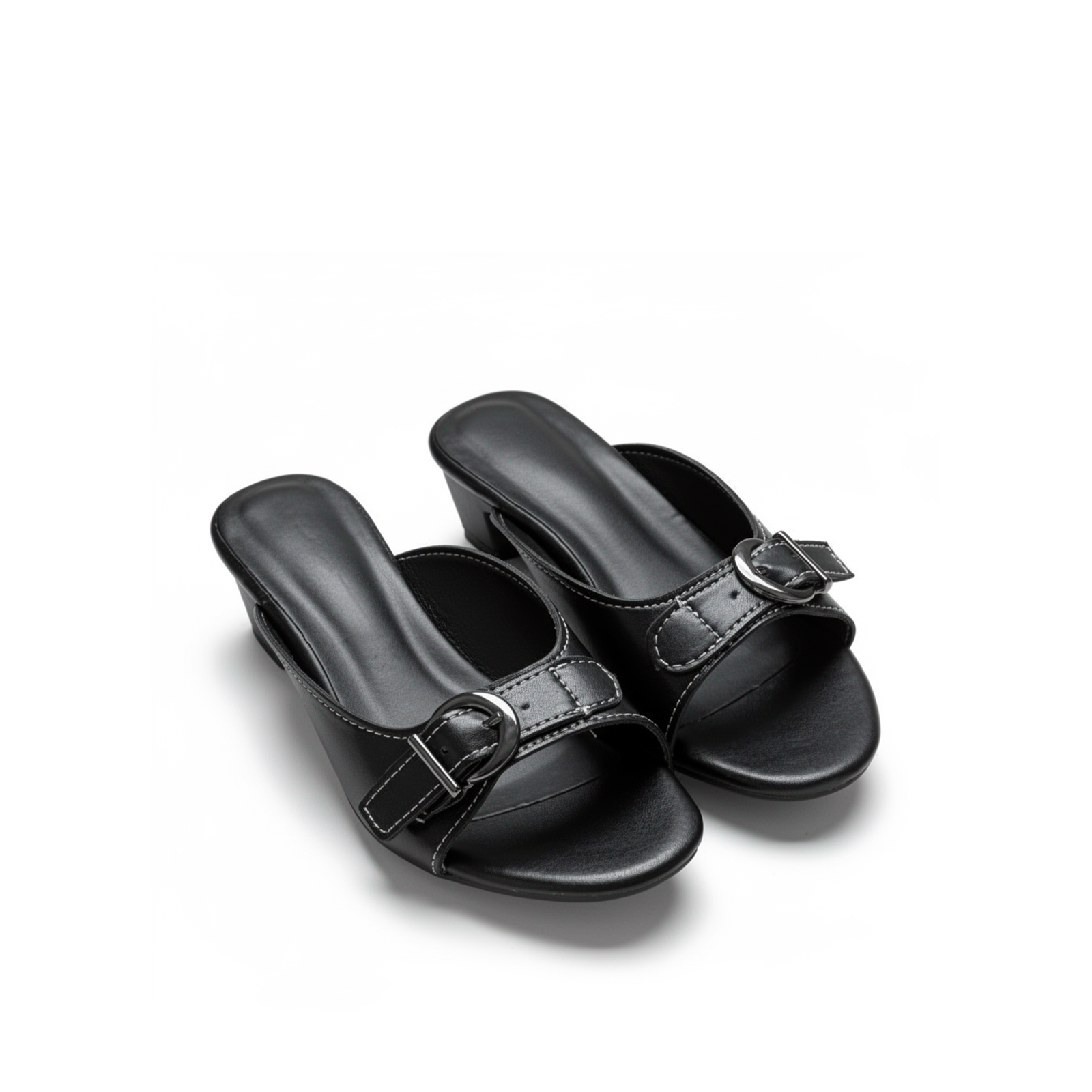 Close-up of buckle strap detail on Belvra black mule heels
