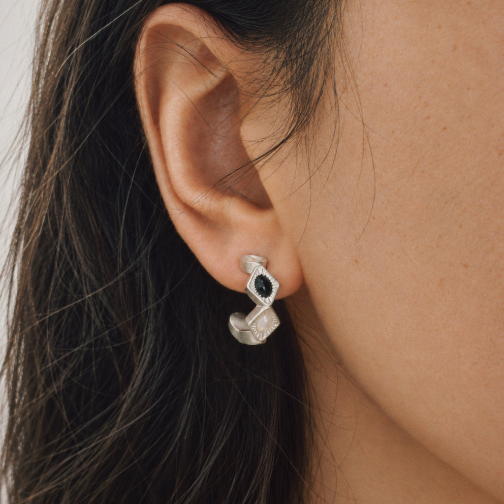 Model wearing the Bolt Zigzag Hoop Earrings, art deco earrings