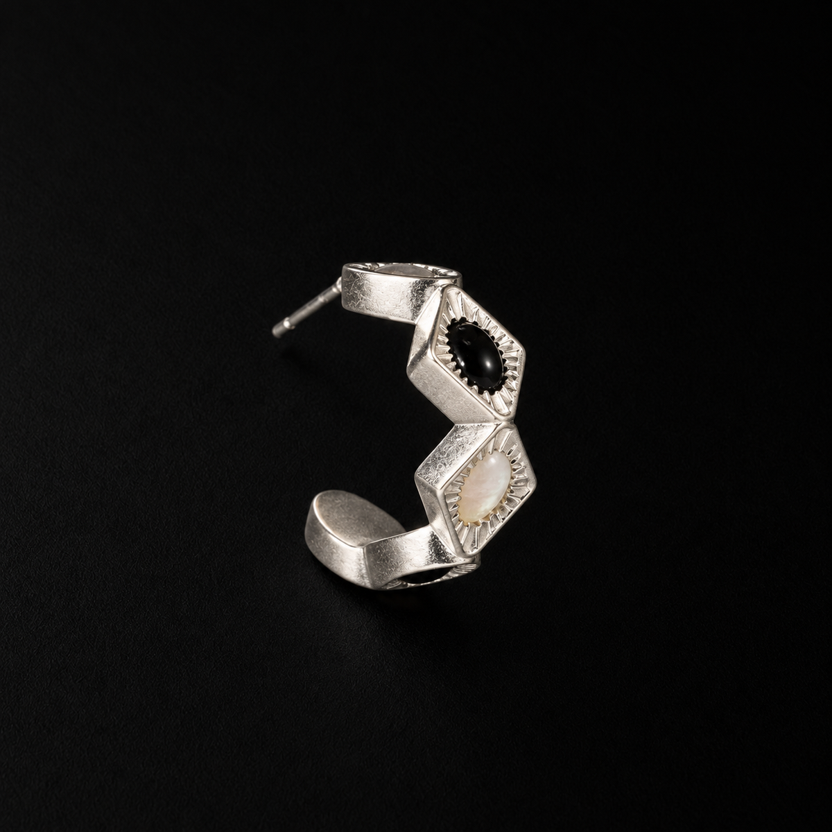 Pair of Bolt Zigzag Hoop Earrings angled together on a dark background, chunky hoop earrings