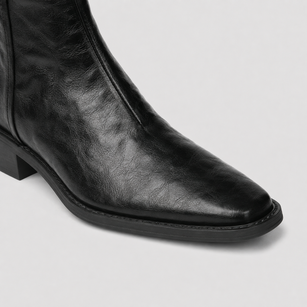 Black Lil Cacti western ankle boots photographed from above on pale flooring
