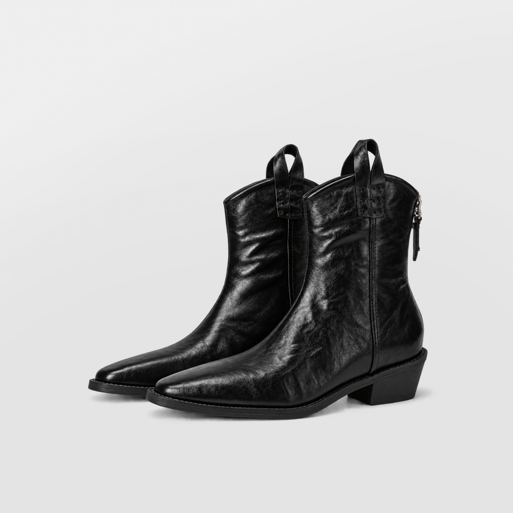 Side profile of a brown western ankle boot showing the side zip closure