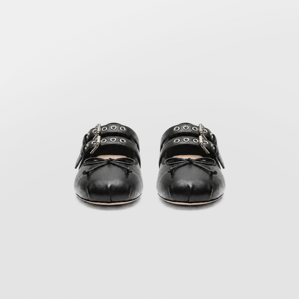Front view of both black Clara ballet flats showing the twin straps and bows