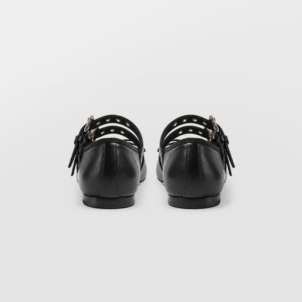 Back view of the black buckle ballet flats standing side by side