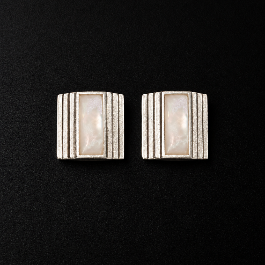 Pair of Column Square Stud Earrings angled together on a dark background