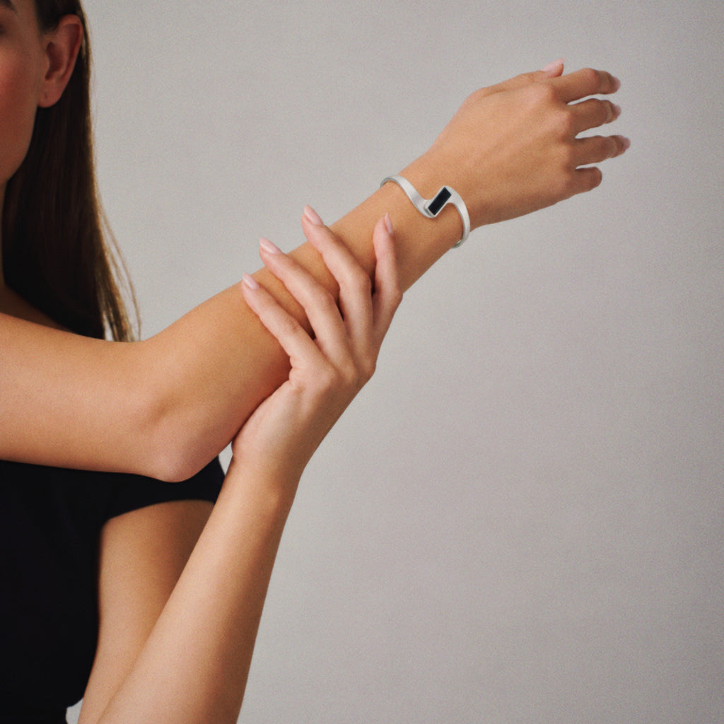 Model wearing the Crest Wave Cuff Bracelet from a side angle