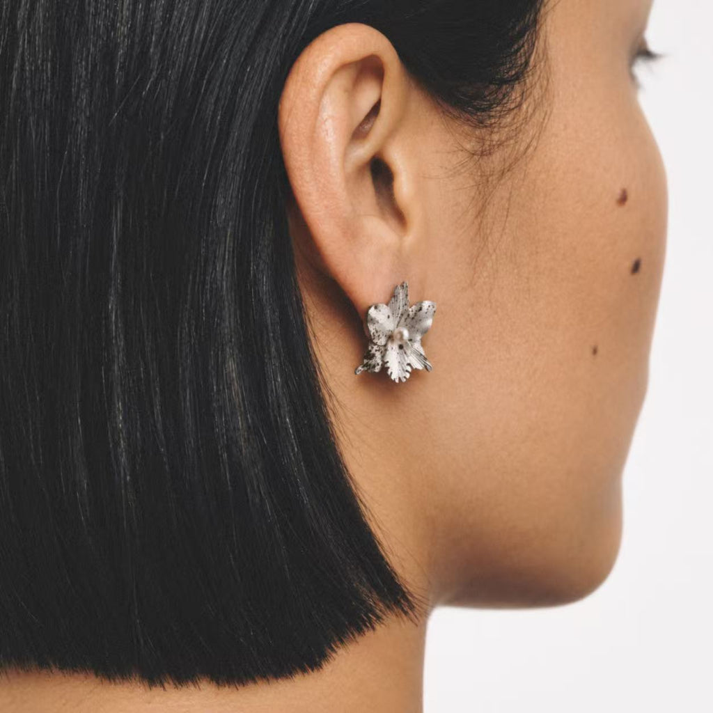 Model wearing the Crushed Orchid Earrings seen from behind by Lil Cacti