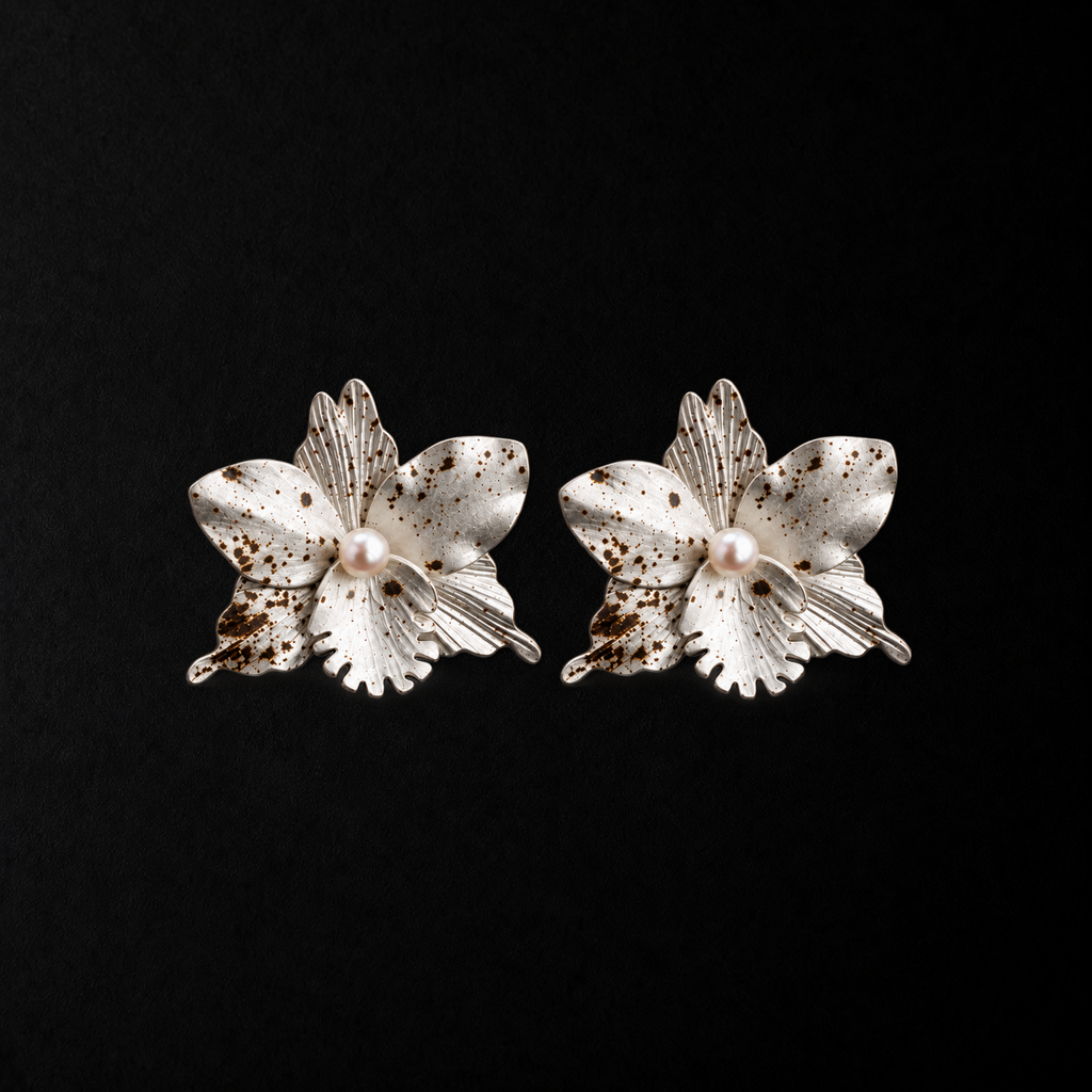Crushed Orchid Earrings product shot from the side on a plain studio background