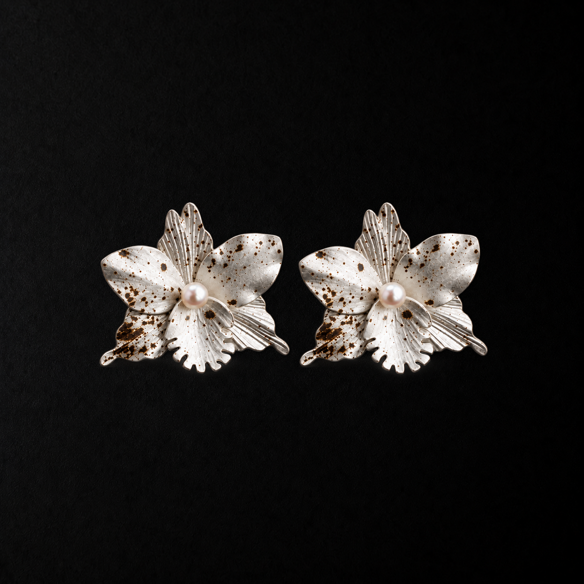 Crushed Orchid Earrings product shot from the side on a plain studio background