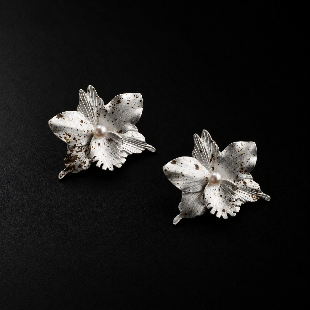 Front view of the Crushed Orchid Earrings in studio light