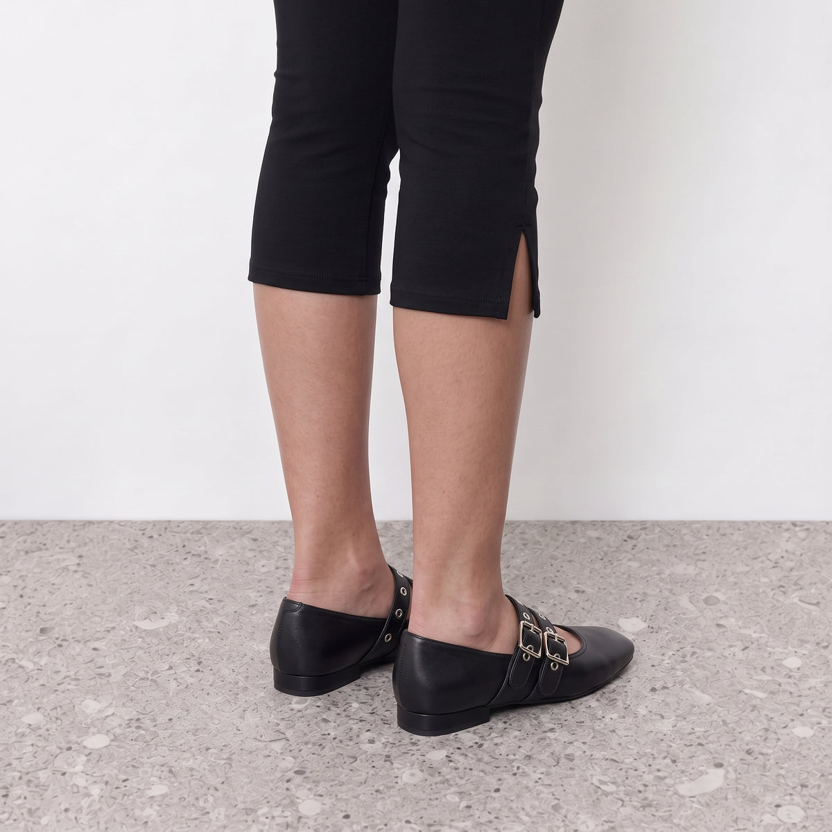 Model standing in Lil Cacti Demi double buckle mary jane flats