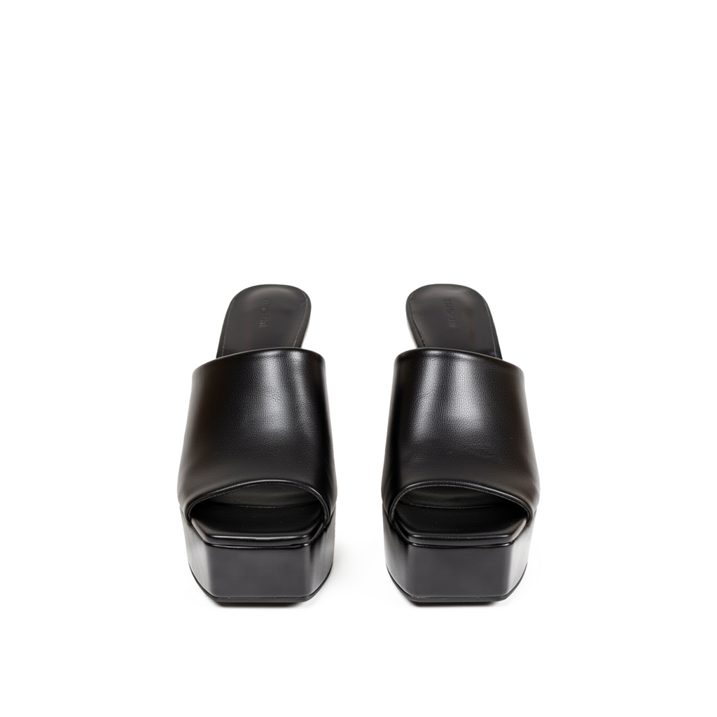 Devora black platform mules three-quarter angle, bold dark feminine styling