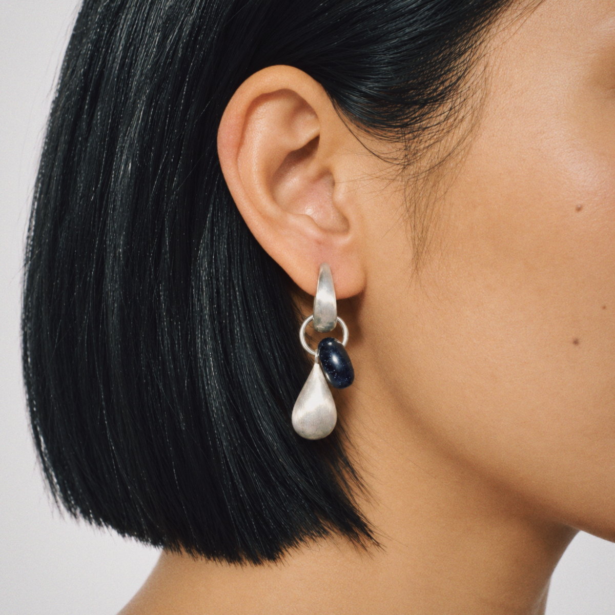 Model wearing Dew Teardrop Charm Hoop Earrings by Lil Cacti, view 2