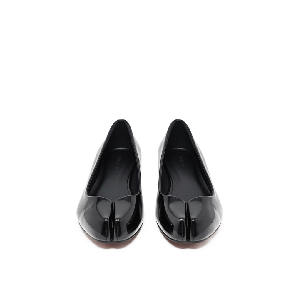 Echo tabi flats close-up — sculptural split-toe detail in black