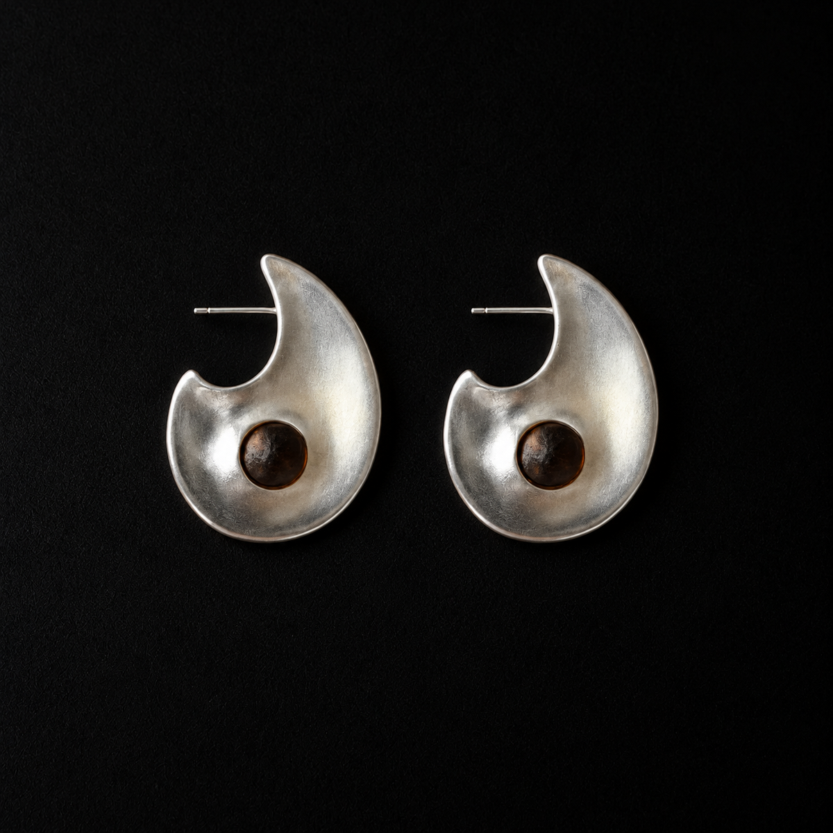 Lil Cacti Eclipse Crescent Stud Earrings shown on its own against a dark background