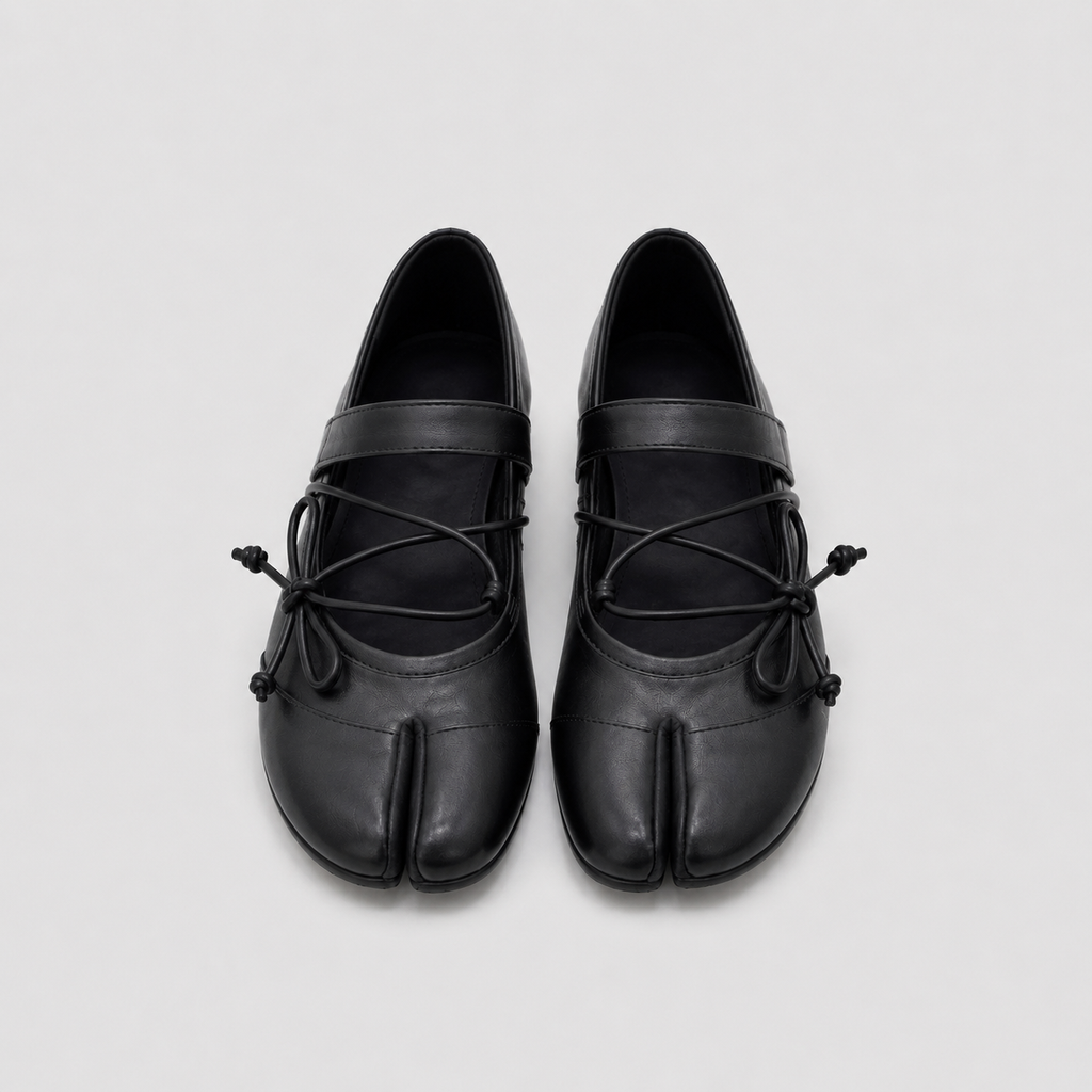 Rear view of black lace-up ballet flats showing the plain low heel
