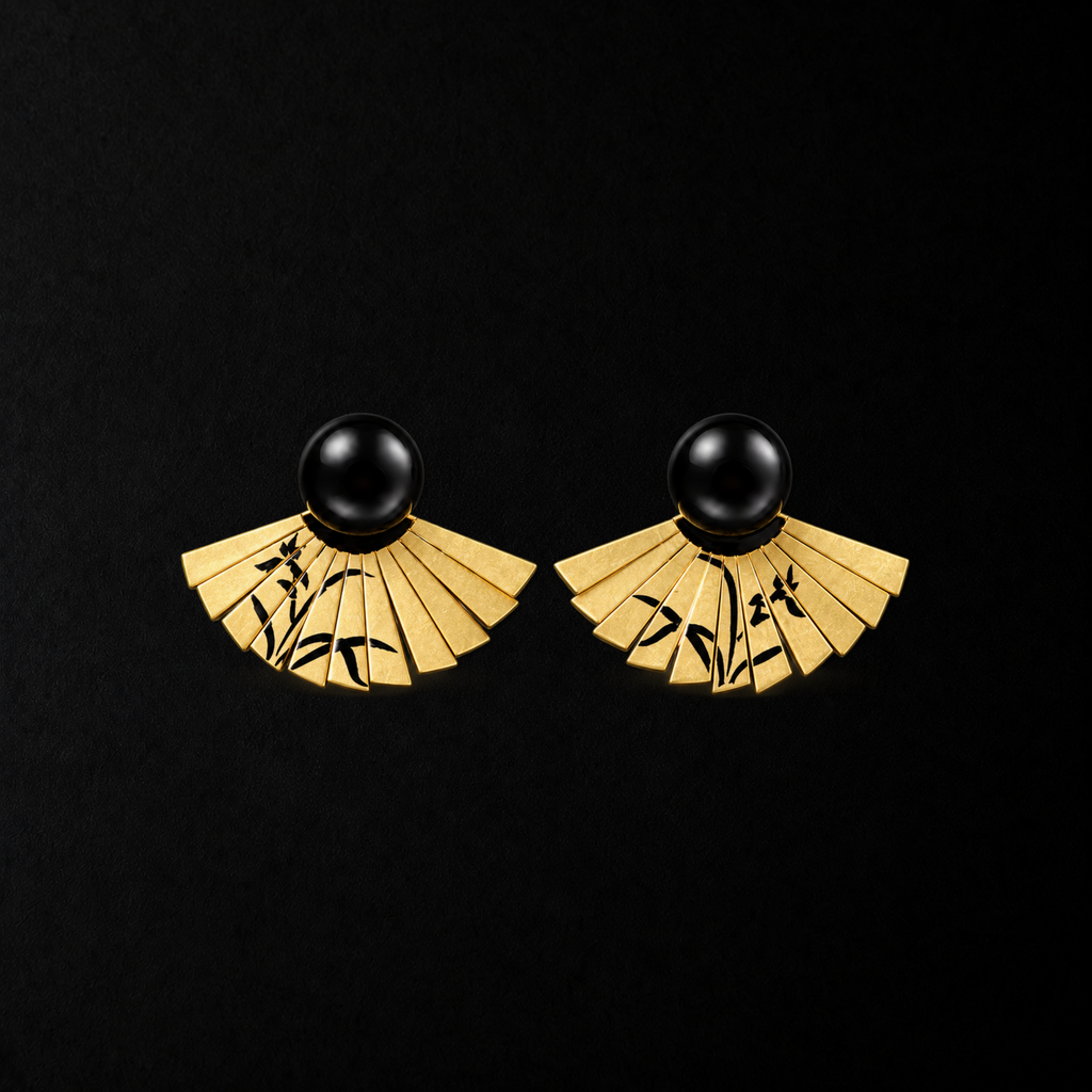 Etched Fan Drop Earrings shown at a three quarter angle in studio light