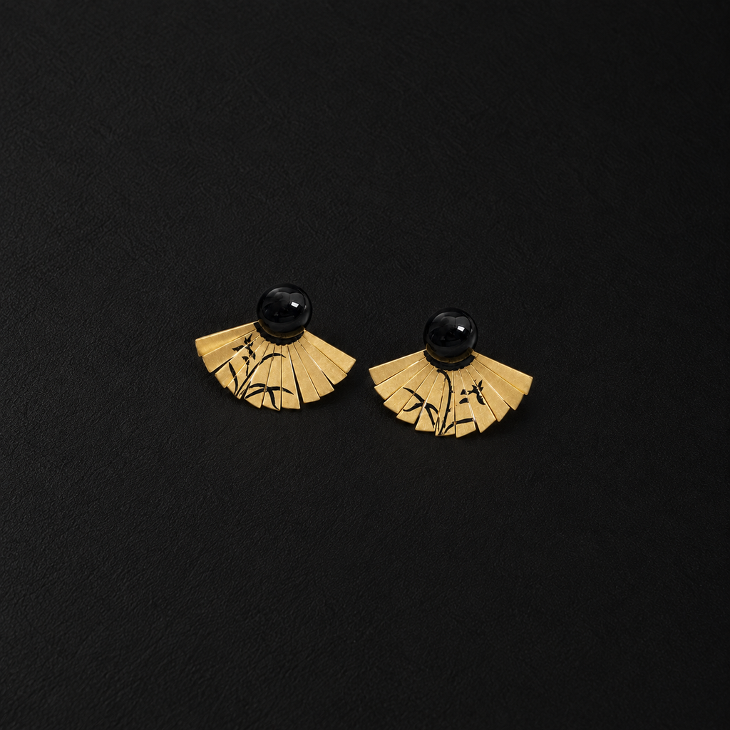 Front view of the Etched Fan Drop Earrings in studio light