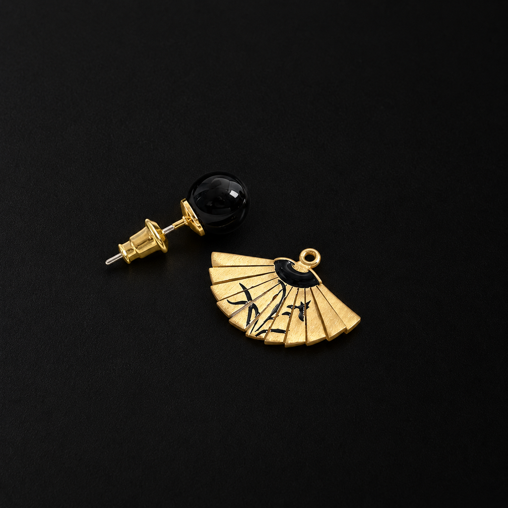 Back view of the Etched Fan Drop Earrings in studio light