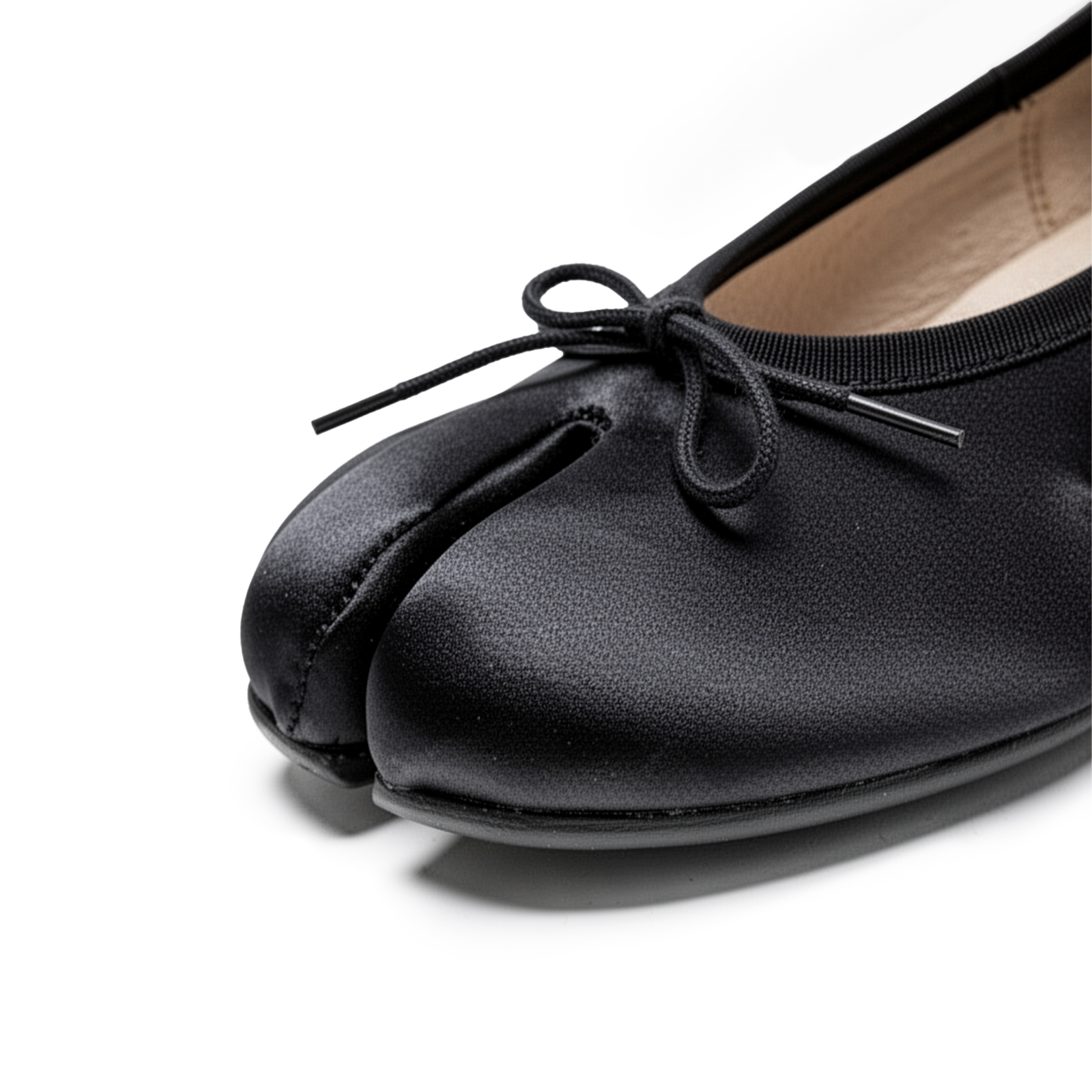 Close-up of tabi split-toe detail on Evelyne black satin ballet flats — Lil Cacti