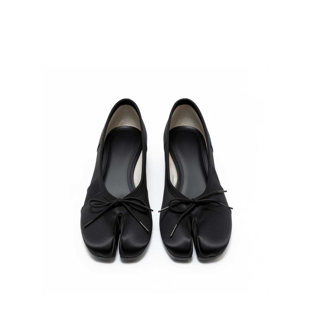 Side profile of Evelyne black satin tabi heels showing heel and satin finish