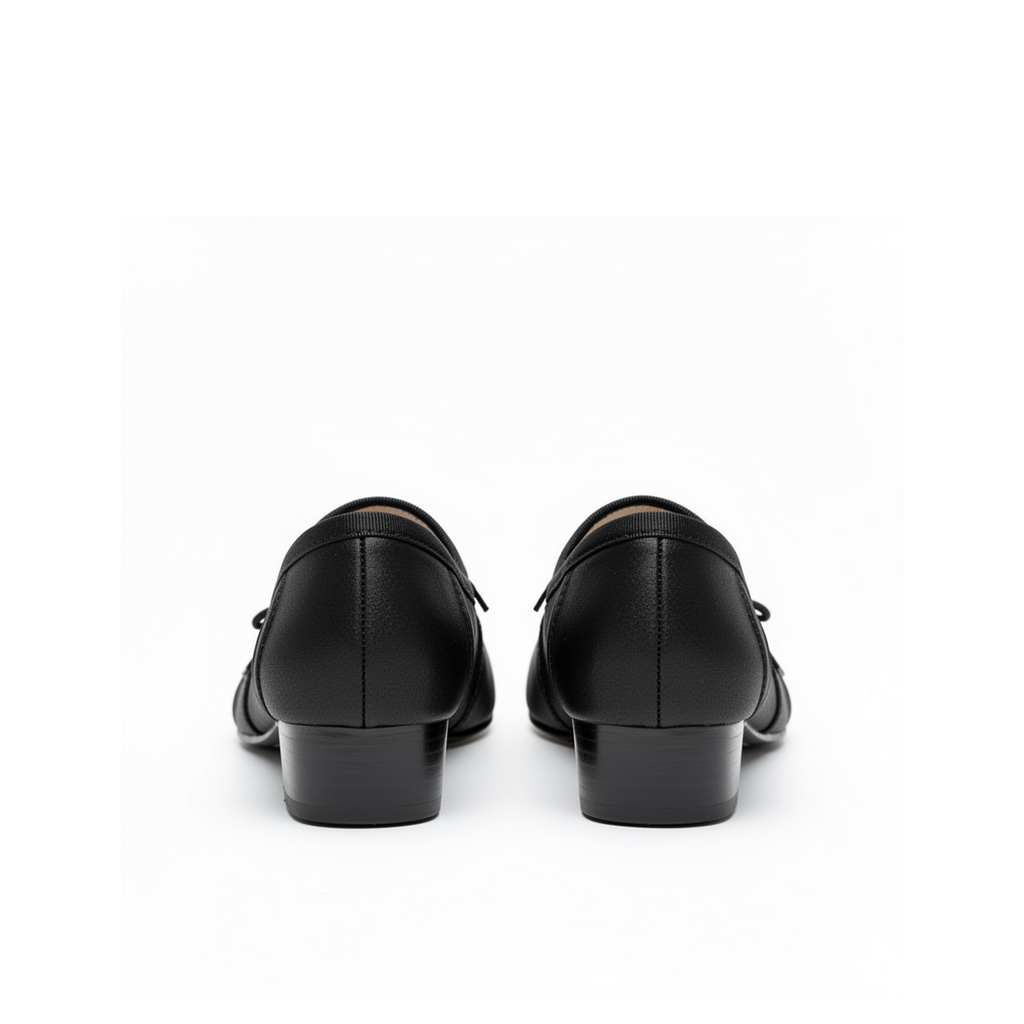 Close-up of tabi split-toe detail on Evelyne black satin heels, dark feminine styling