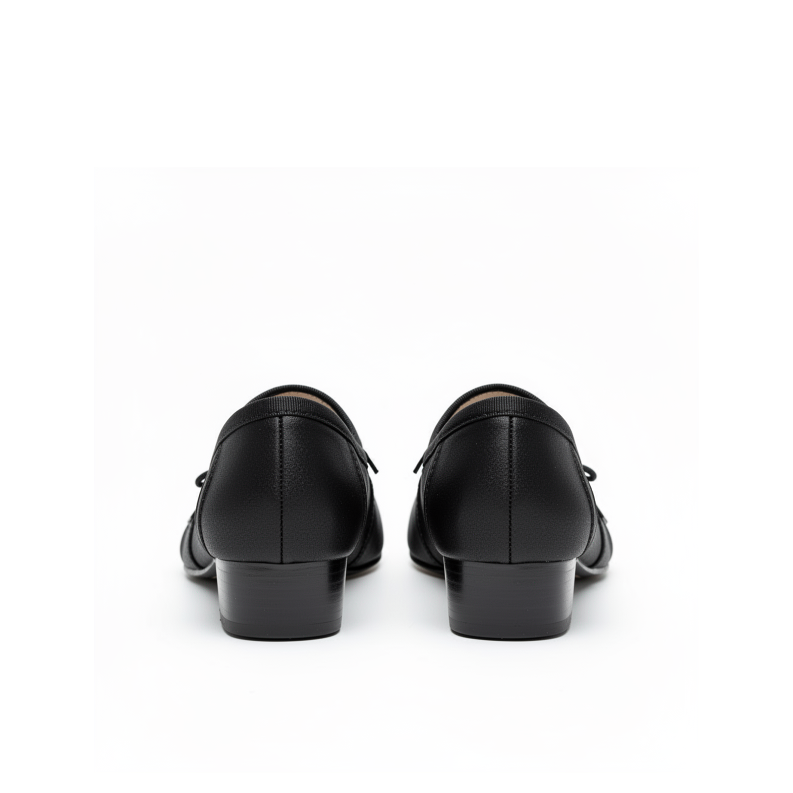 Close-up of tabi split-toe detail on Evelyne black satin heels, dark feminine styling