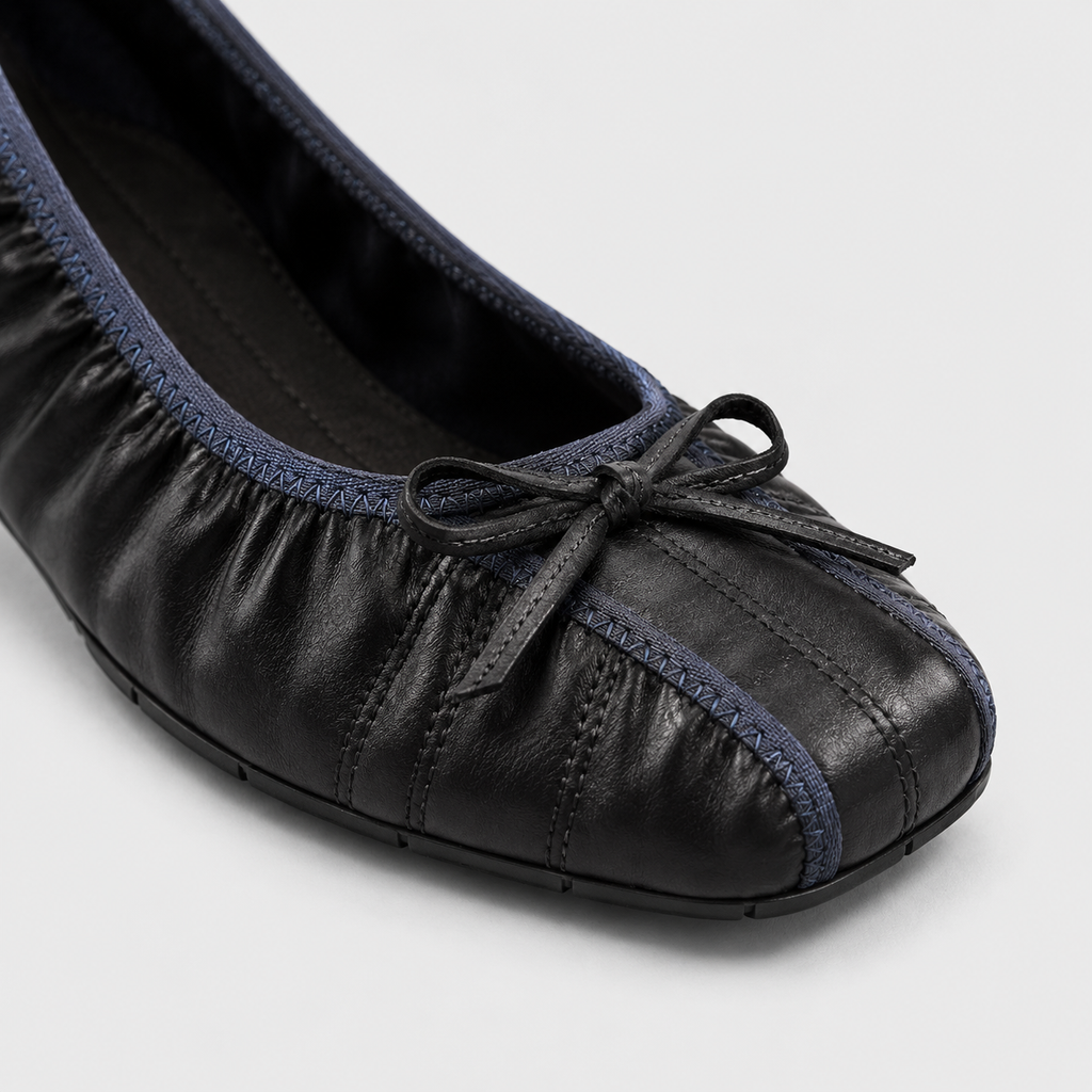 Close-up of Faye Ruched Bow Ballet Flats in black, highlighting the upper and finish