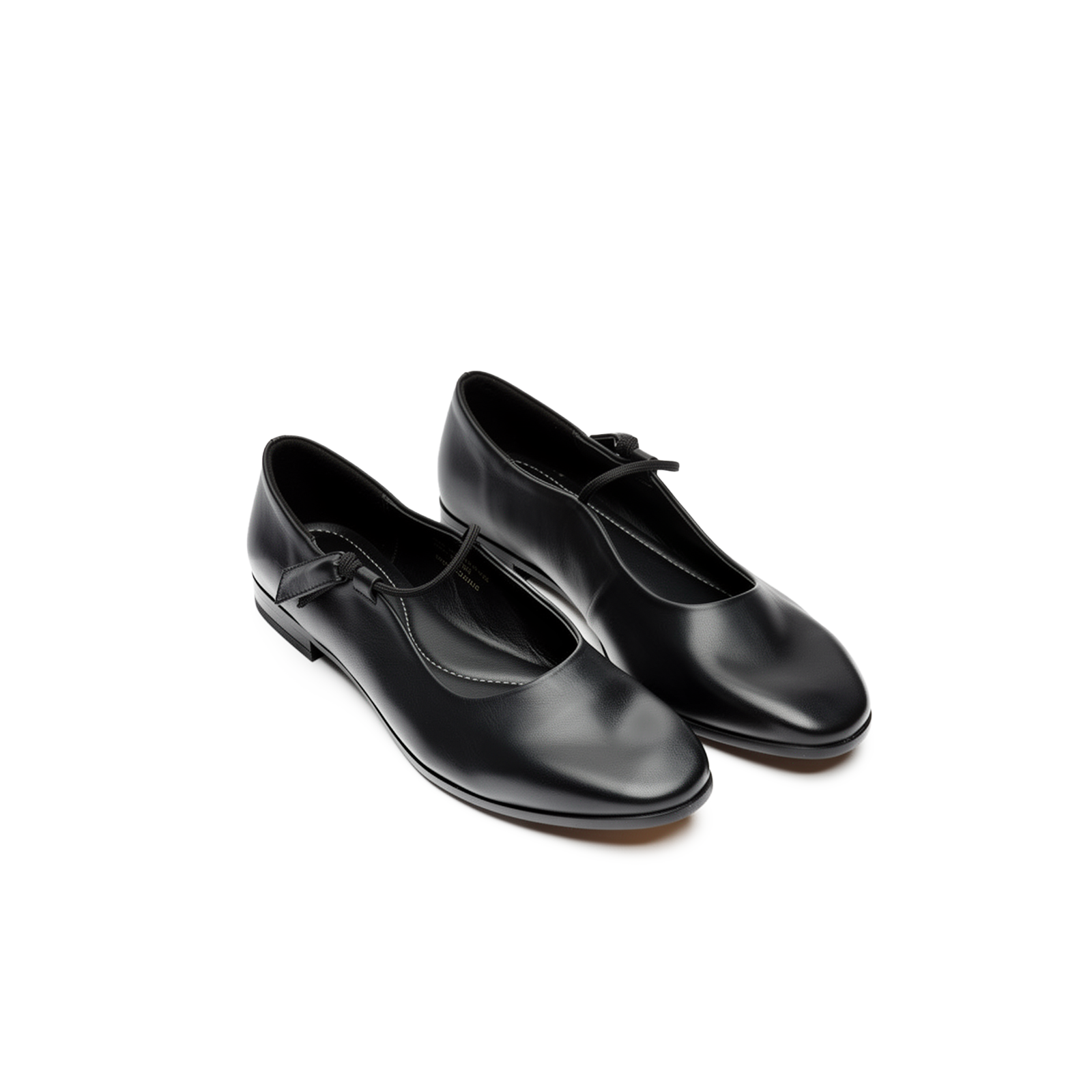Side profile of Fiora black leather mary jane flats showing flat sole and strap