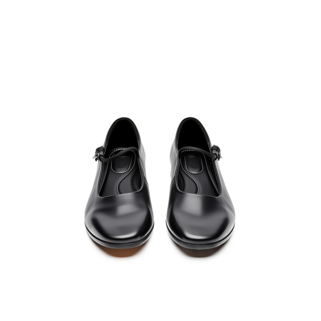 Close-up of mary jane crossover strap on Fiora black leather ballet flats — Lil Cacti