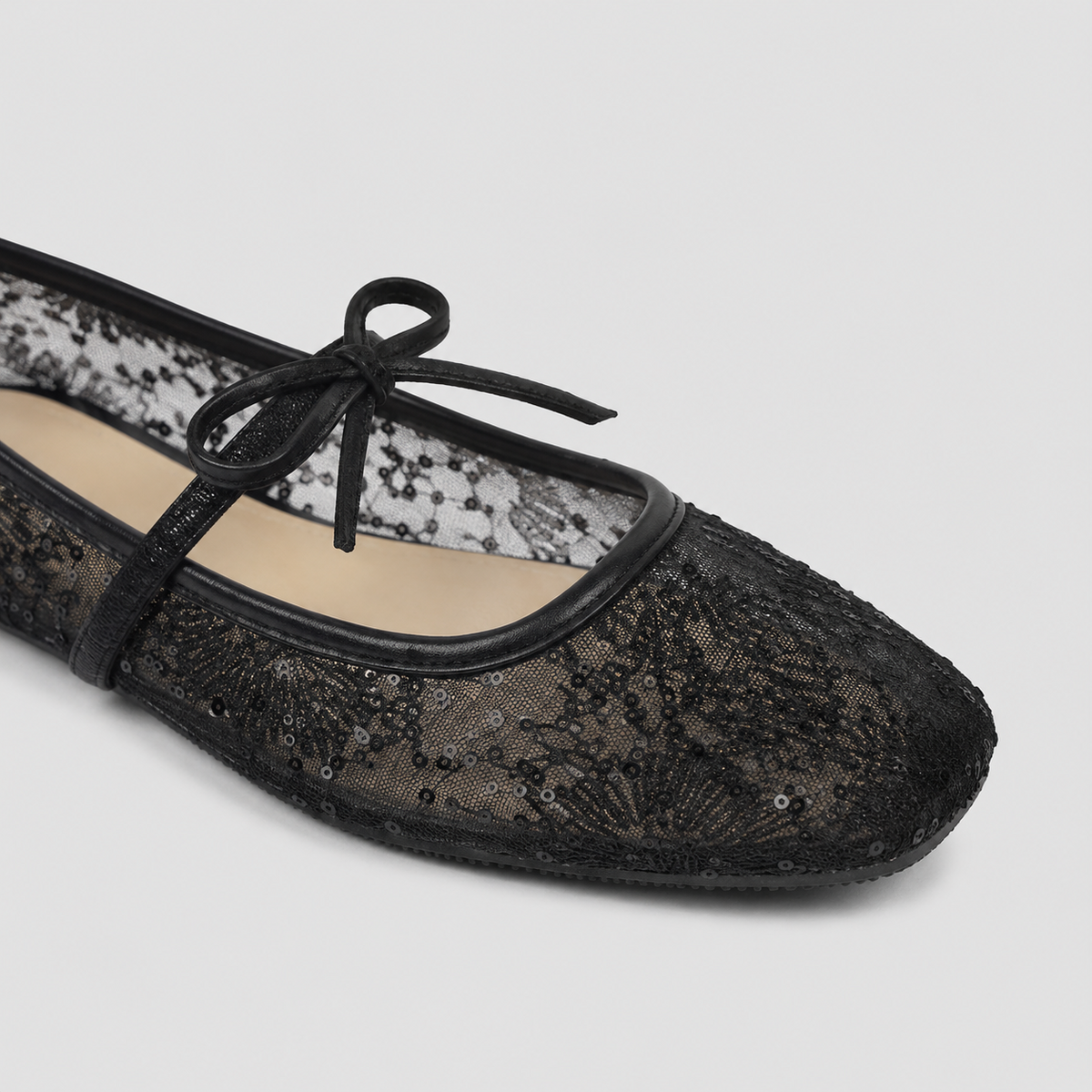 Florence black Lace Ballet Flats by Lil Cacti — close-up of the square toe, floral lace with micro sequins and bow strap