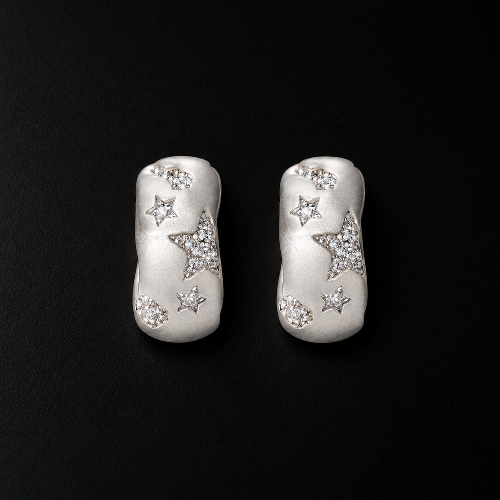 Lil Cacti star huggie earrings showing shape and finish on dark background