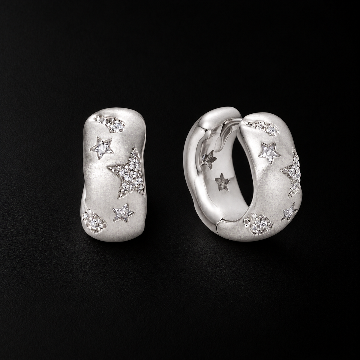 Lil Cacti star huggie earrings showing shape and finish on dark background