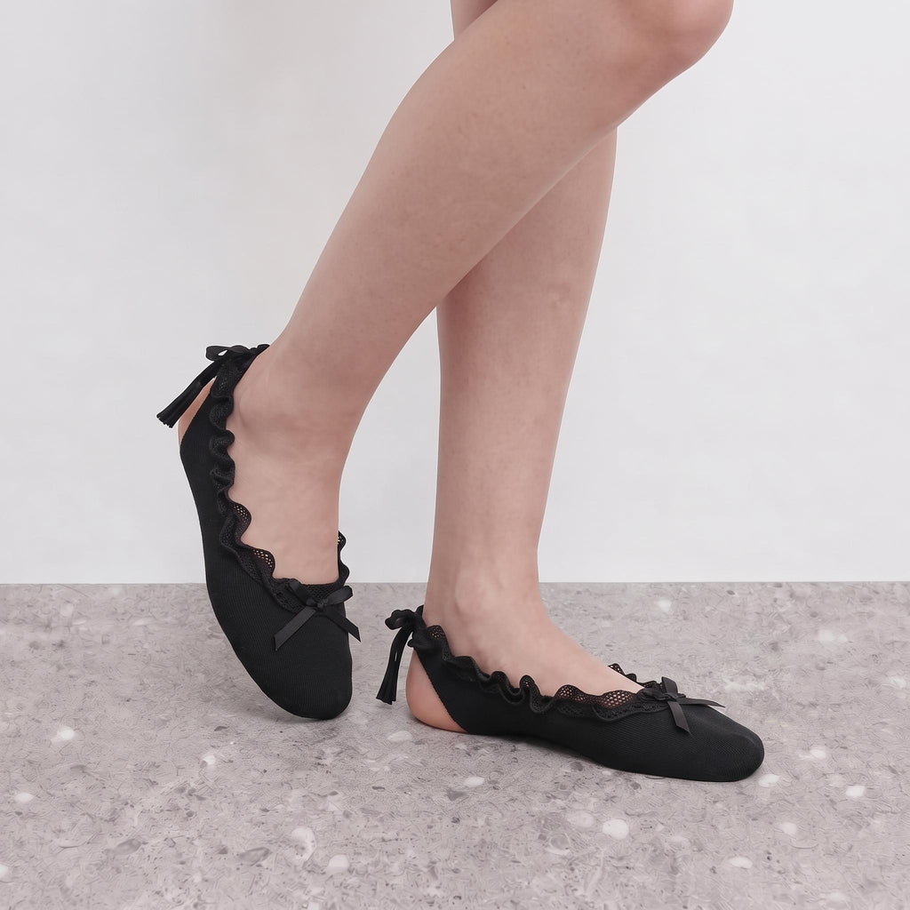 Giselle Ruffle Ballet Socks by Lil Cacti in black, close-up on crossed legs