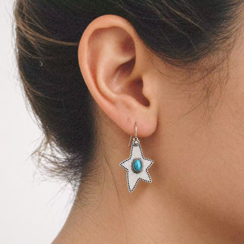 Close-up of the Halcyon Western Star Earrings, showing the finish and shape up close