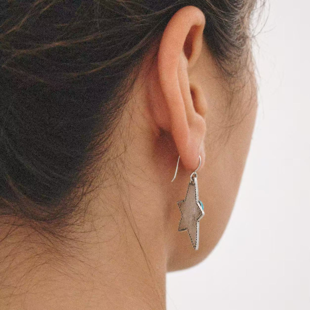 Western earrings from Lil Cacti: the Halcyon Western Star Earrings shown from the side