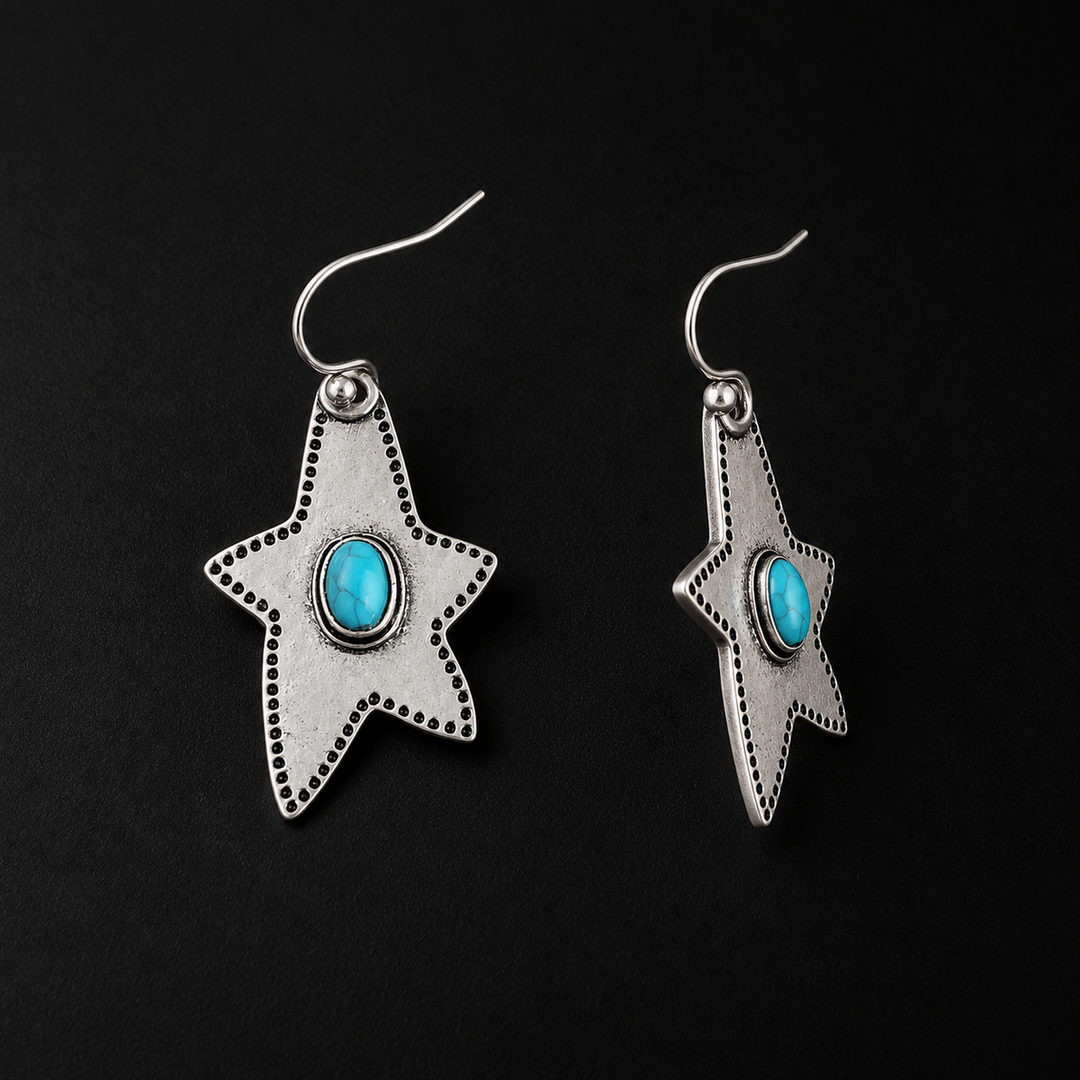 Halcyon Western Star Earrings worn on the ear, star earrings