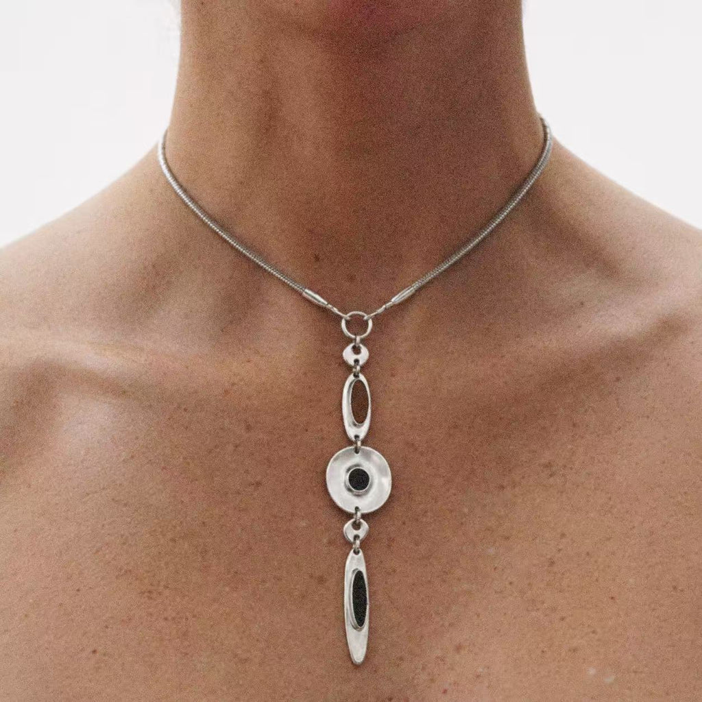 Model wearing the Halo Drop Collar Necklace seen from the front