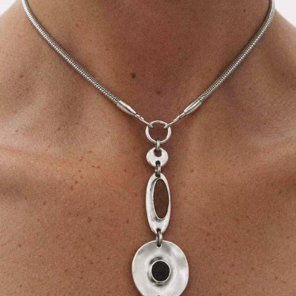 Model wearing the Halo Drop Collar Necklace seen from behind