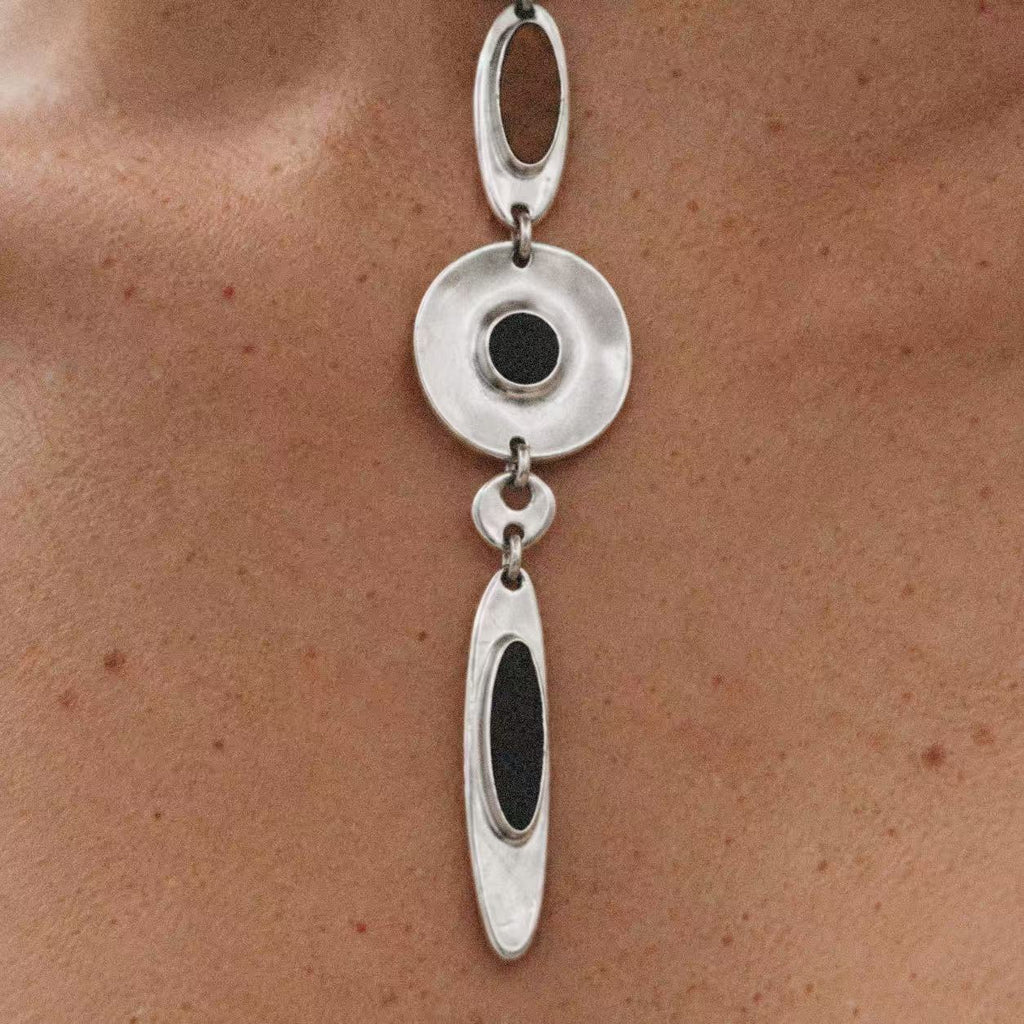 Model wearing the Halo Drop Collar Necklace in a close crop