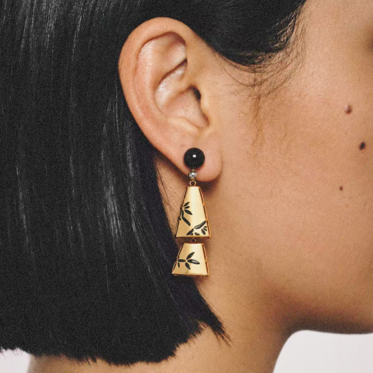 Ink Bamboo Tiered Drop Earrings worn on the ear, chinoiserie jewelry
