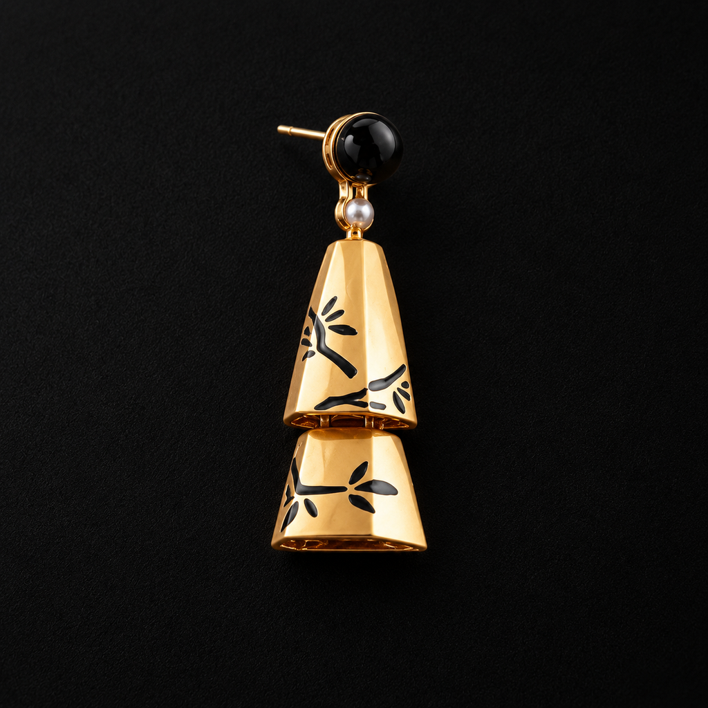 Detail view of the Ink Bamboo Tiered Drop Earrings, cone earrings