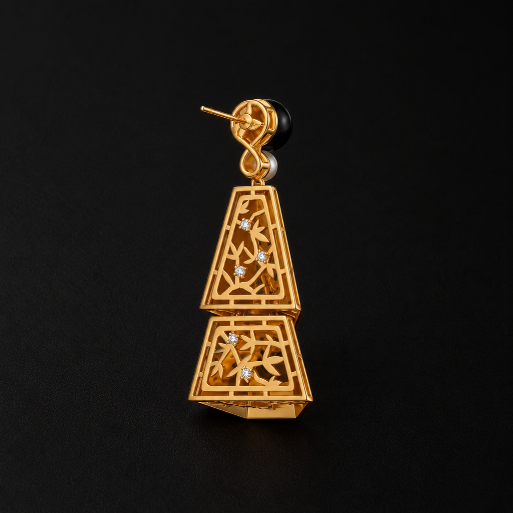 The Ink Bamboo Tiered Drop Earrings laid flat, a chinoiserie jewelry in full view